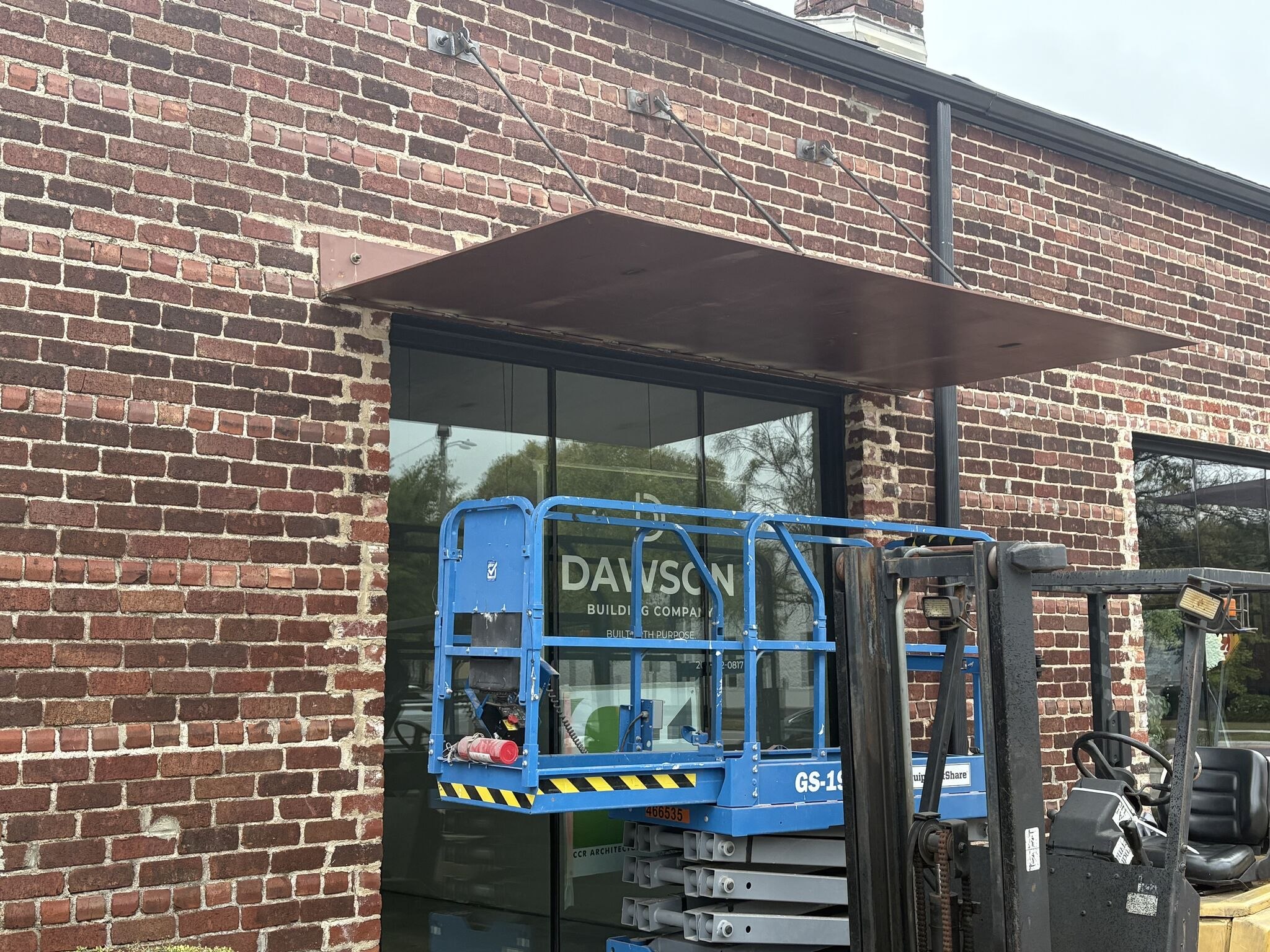 Dawson's lift outside the brick storefront at Pepper Place