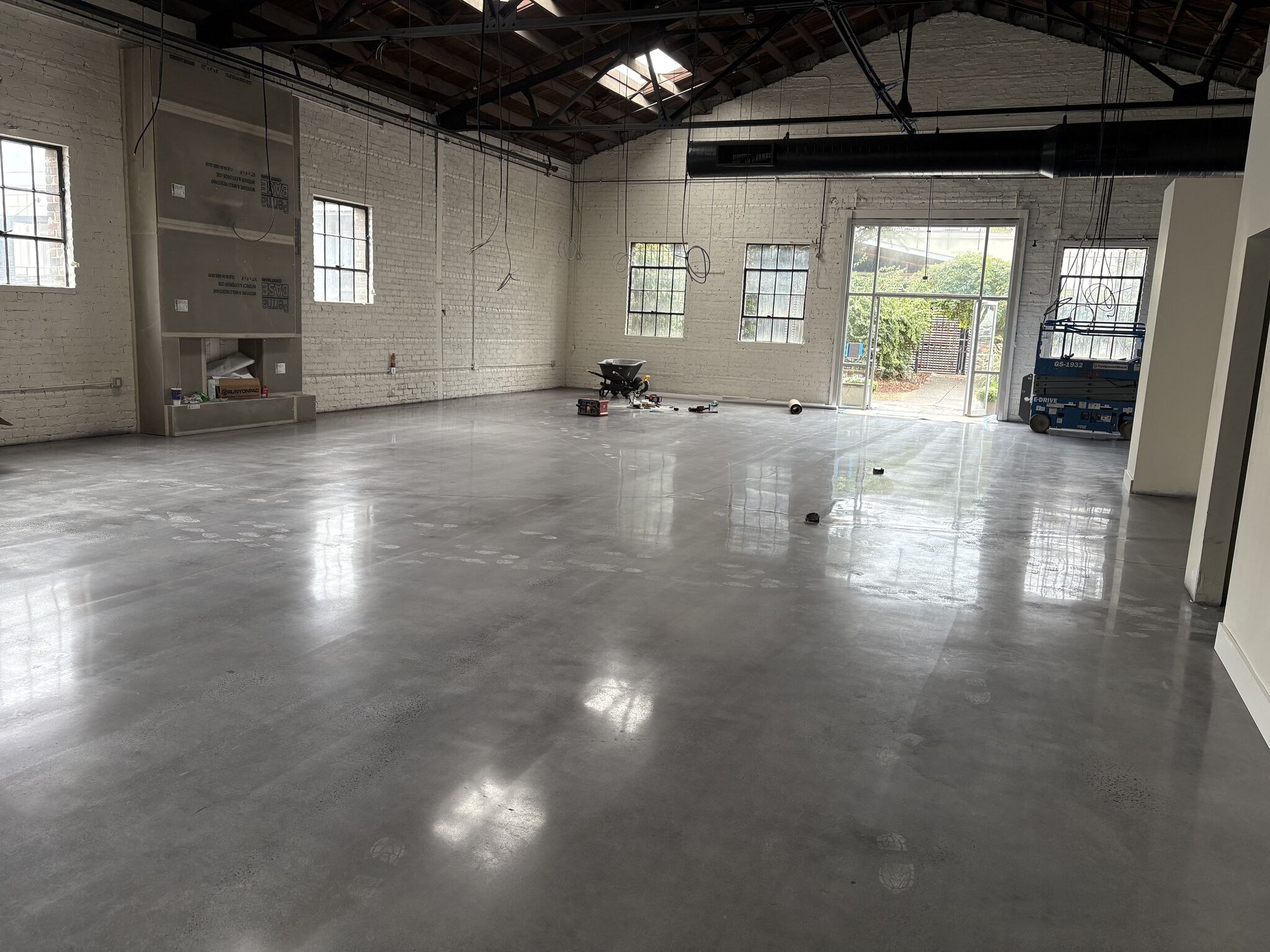 The open showroom floor with polished concrete before fixtures went in